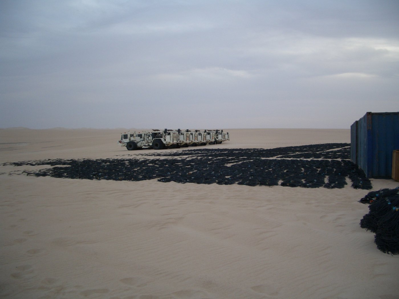 A seismic vibrator truck working on a survey line
