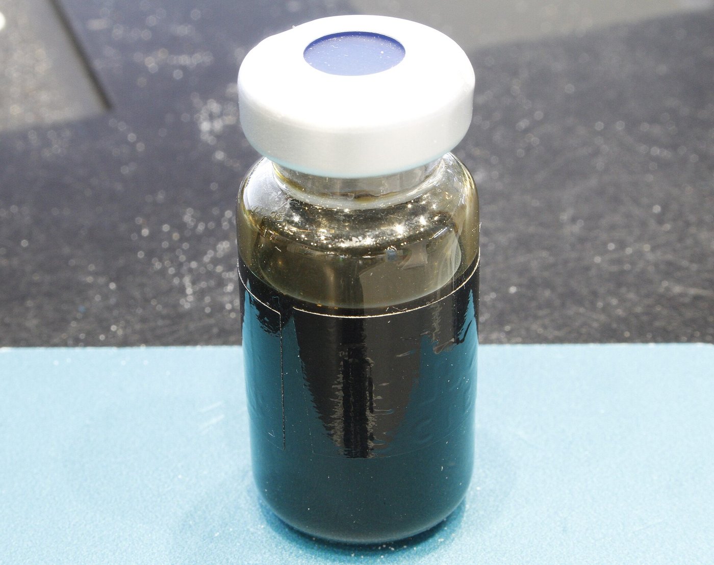 A sample of dark crude oil
