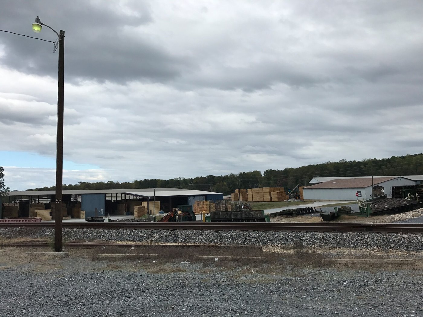 A lumber yard with stacked graded timber
