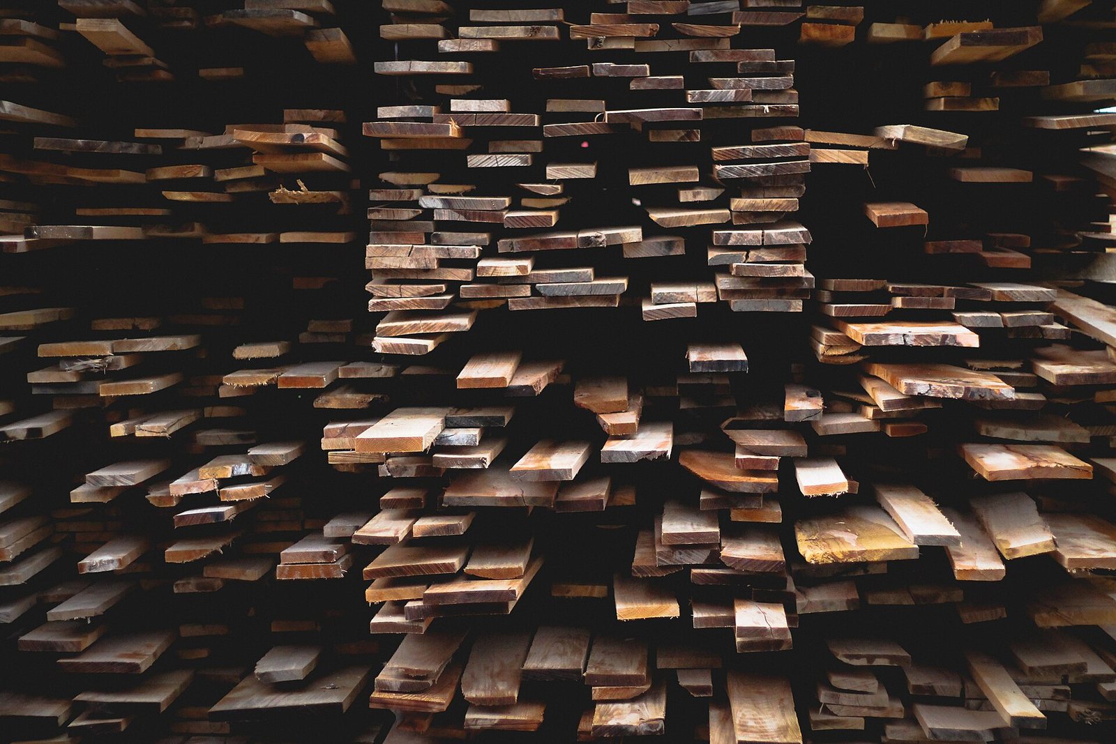 Sawn softwood planks stacked in a timber yard